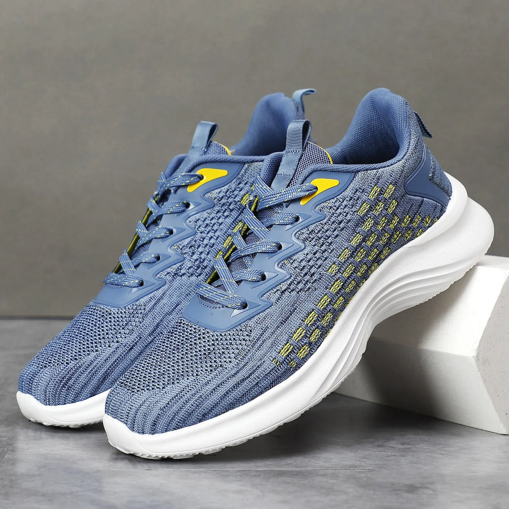Women's lavender purple Flyknit mesh running shoes with round toe and flat wedge heel on a white background.