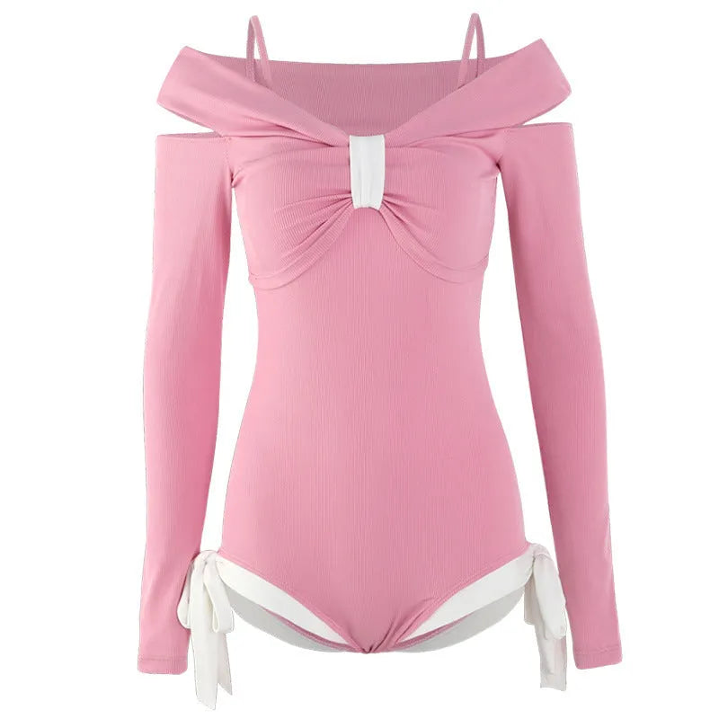 Women's long sleeve one-piece swimsuit in pink or black with figure-flattering design