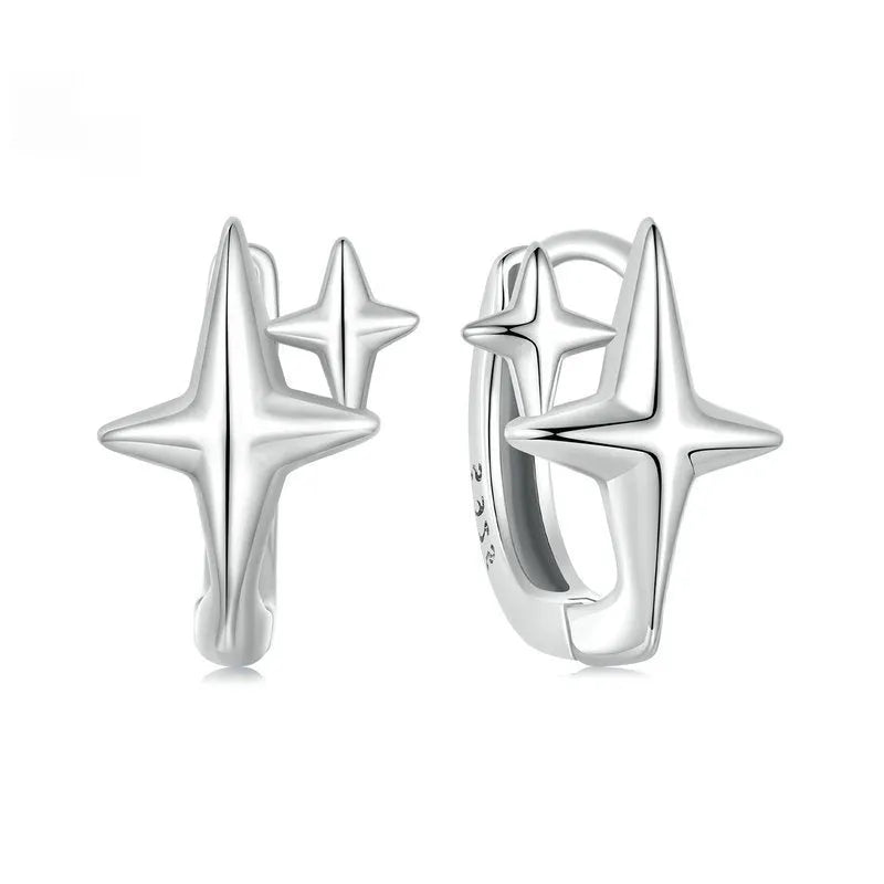 Sterling silver minimalist star ear clips with oxidised finish and XINGX symbol design