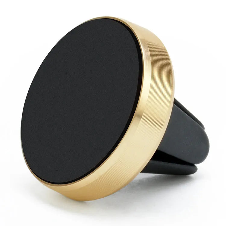Magnetic car phone holder mounted on air vent with mobile phone attached