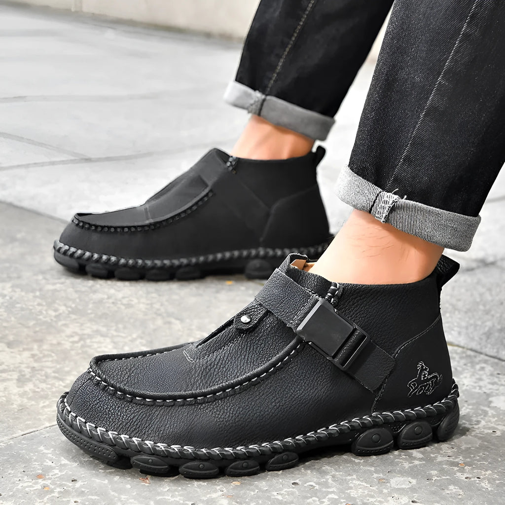 Black casual PU leather slip-on loafers with visible handmade stitching on a flat, low-heel sole.