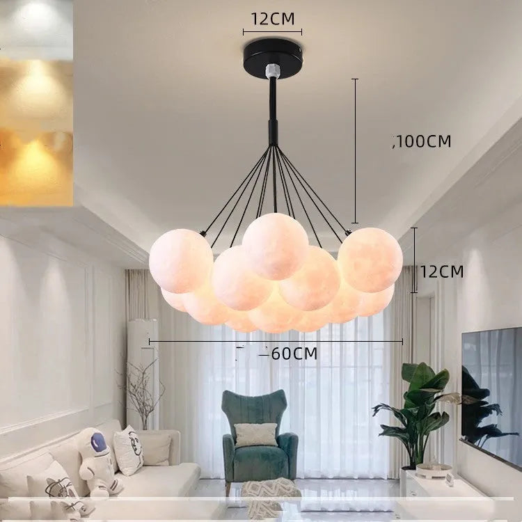 Nordic fish chandelier with moon bubble design in gold or black colours, showing iron body and PMMA lampshades