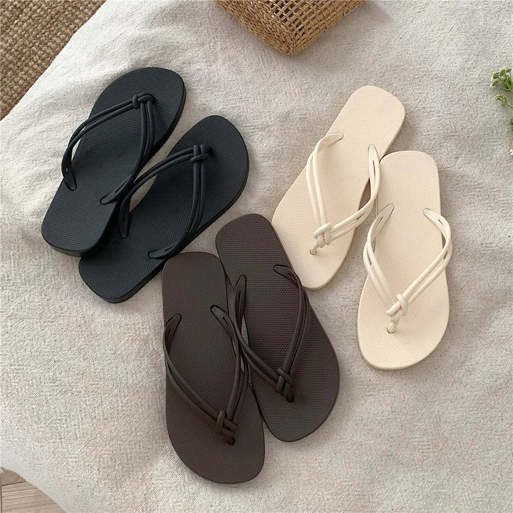 Men's PVC toe-covering flip flops in beige colour on a plain background.