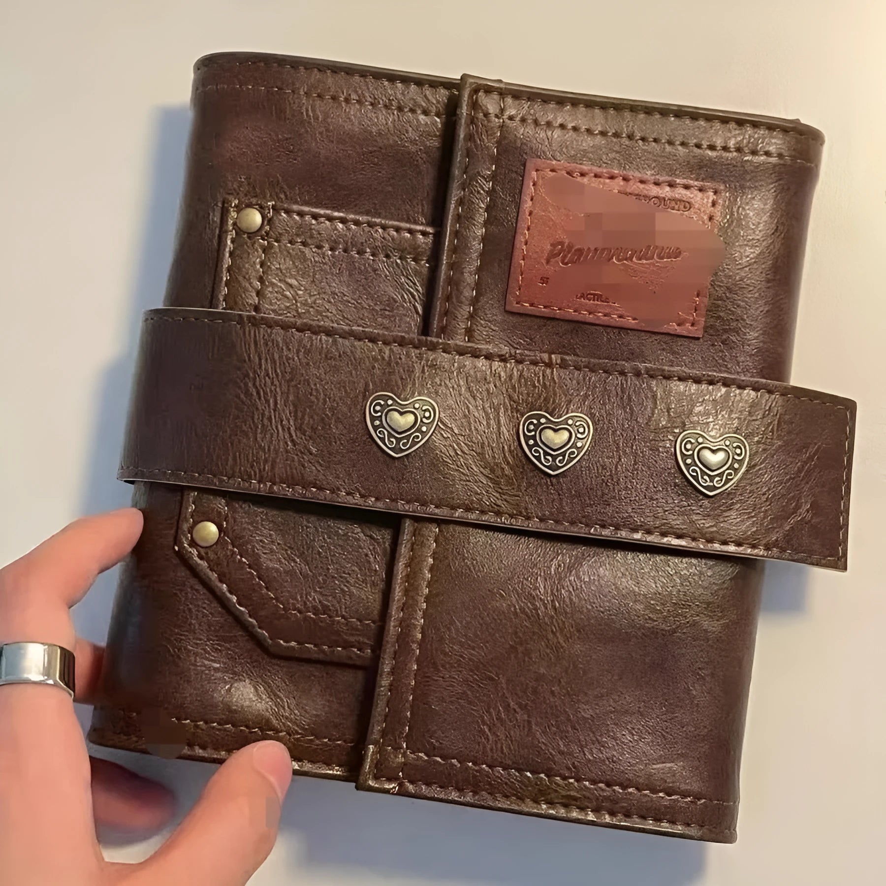 Brown retro leather buckle notebook with A7 size and loose-leaf binding