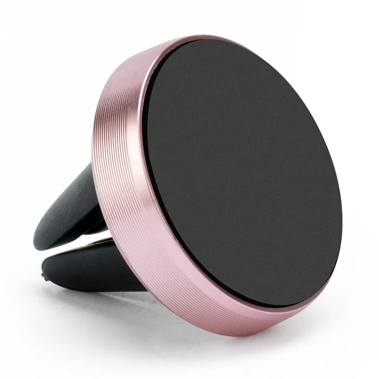 Magnetic car phone holder mounted on air vent with mobile phone attached