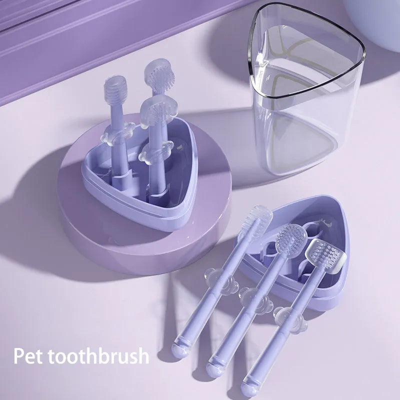 Soft silicone pet toothbrush for dogs and cats in purple, blue, and green colours with curved handle