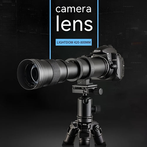 420-800mm manual telephoto zoom camera lens with T-port adapter ring on a table