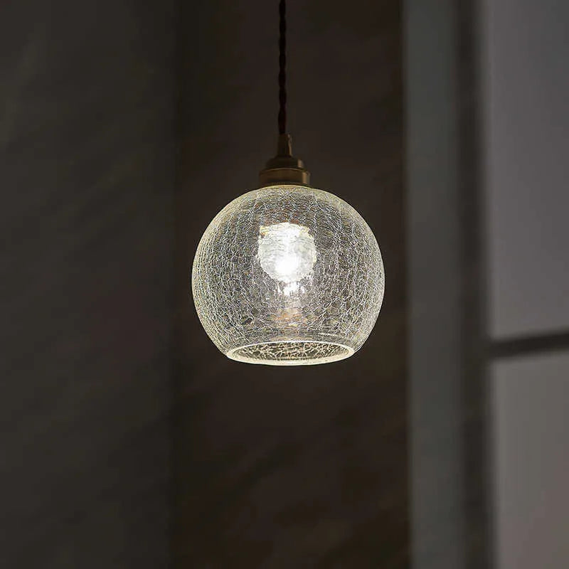 Brass and glass ball chandelier with copper body and clear spherical shade, shown in diamond colour.