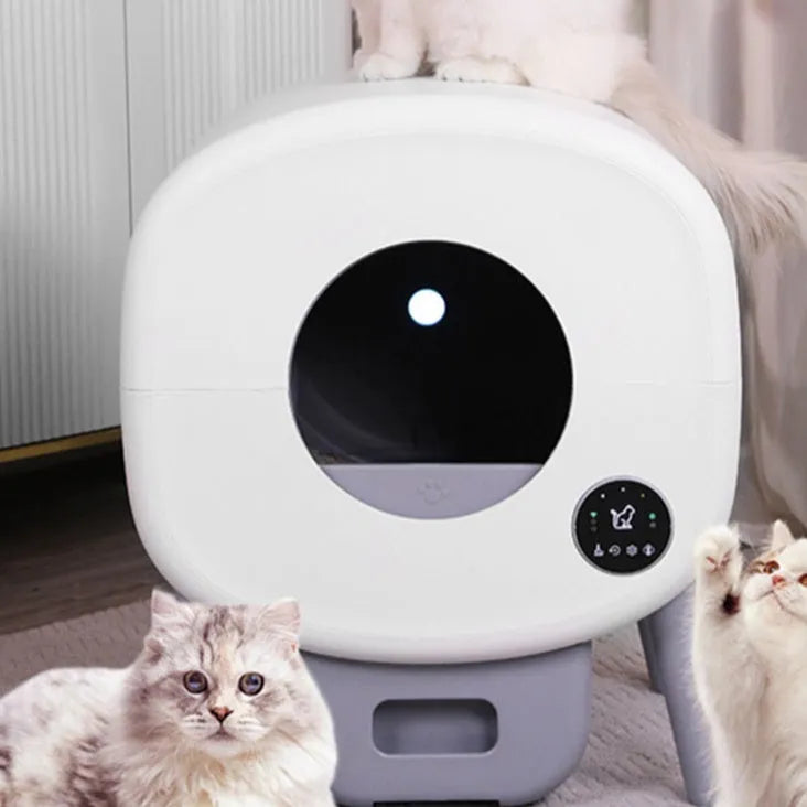 White automatic cat litter box with control panel and waste storage compartment for self-cleaning pet toilet