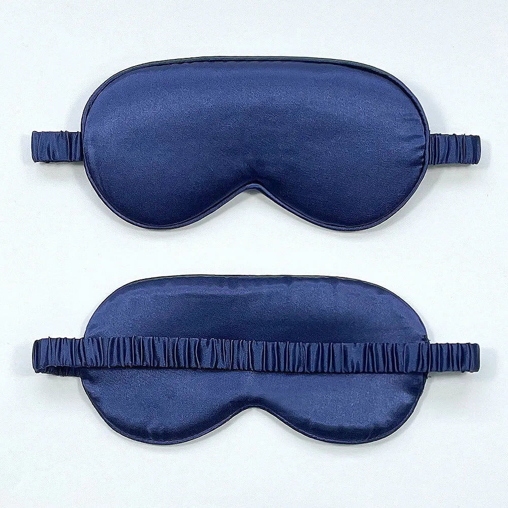 Double-sided silk-like sleep mask in rayon satin, shown in multiple colour options on a white background.