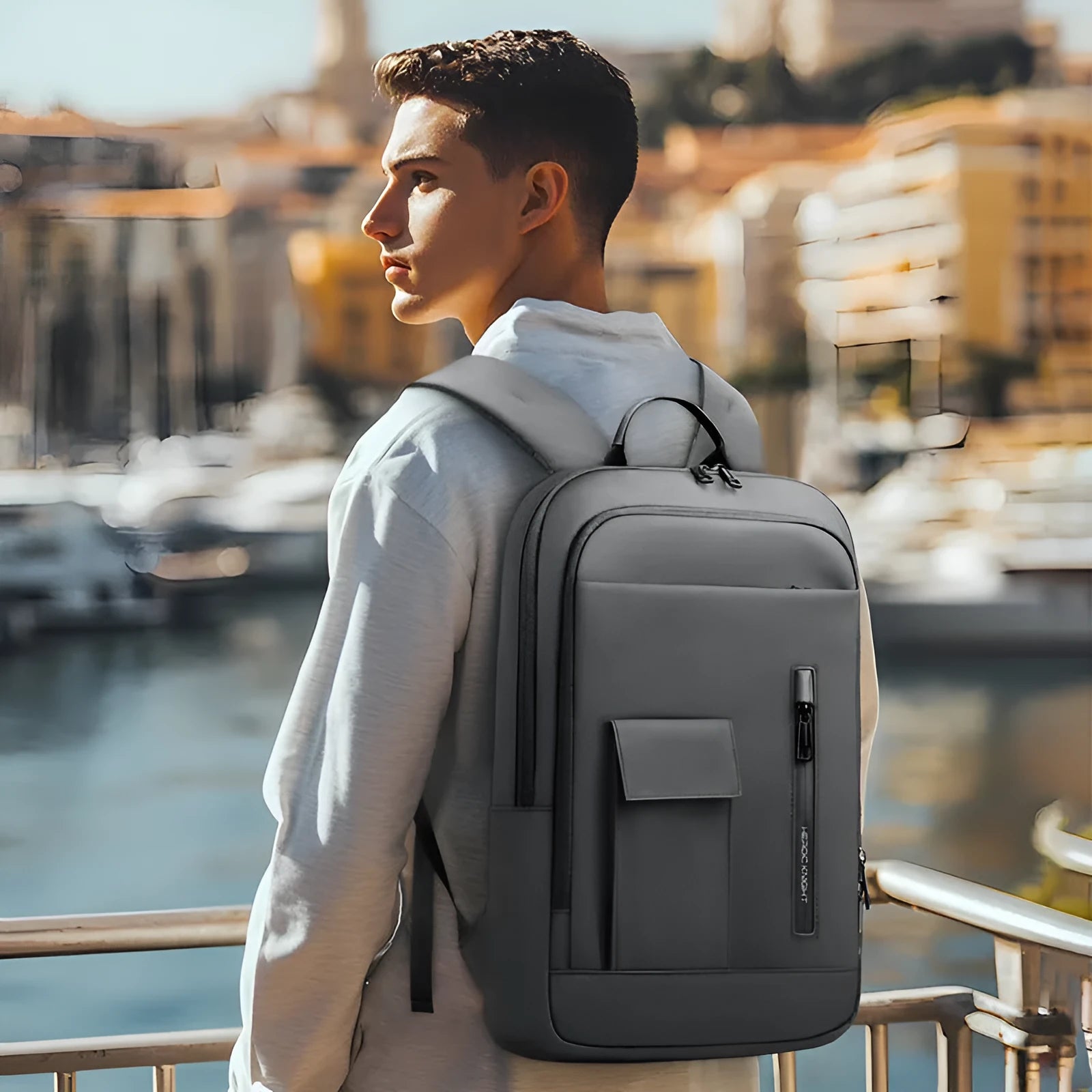 Lightweight Oxford cloth men's backpack in a solid colour with sewing line details.
