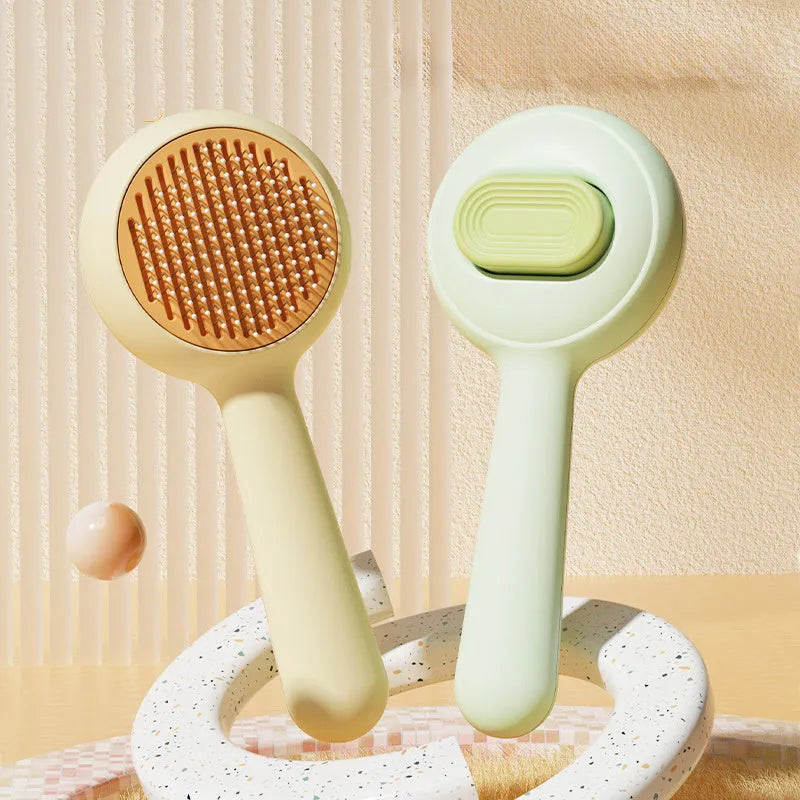 Stainless steel cat grooming brush with non-slip handle in green colour