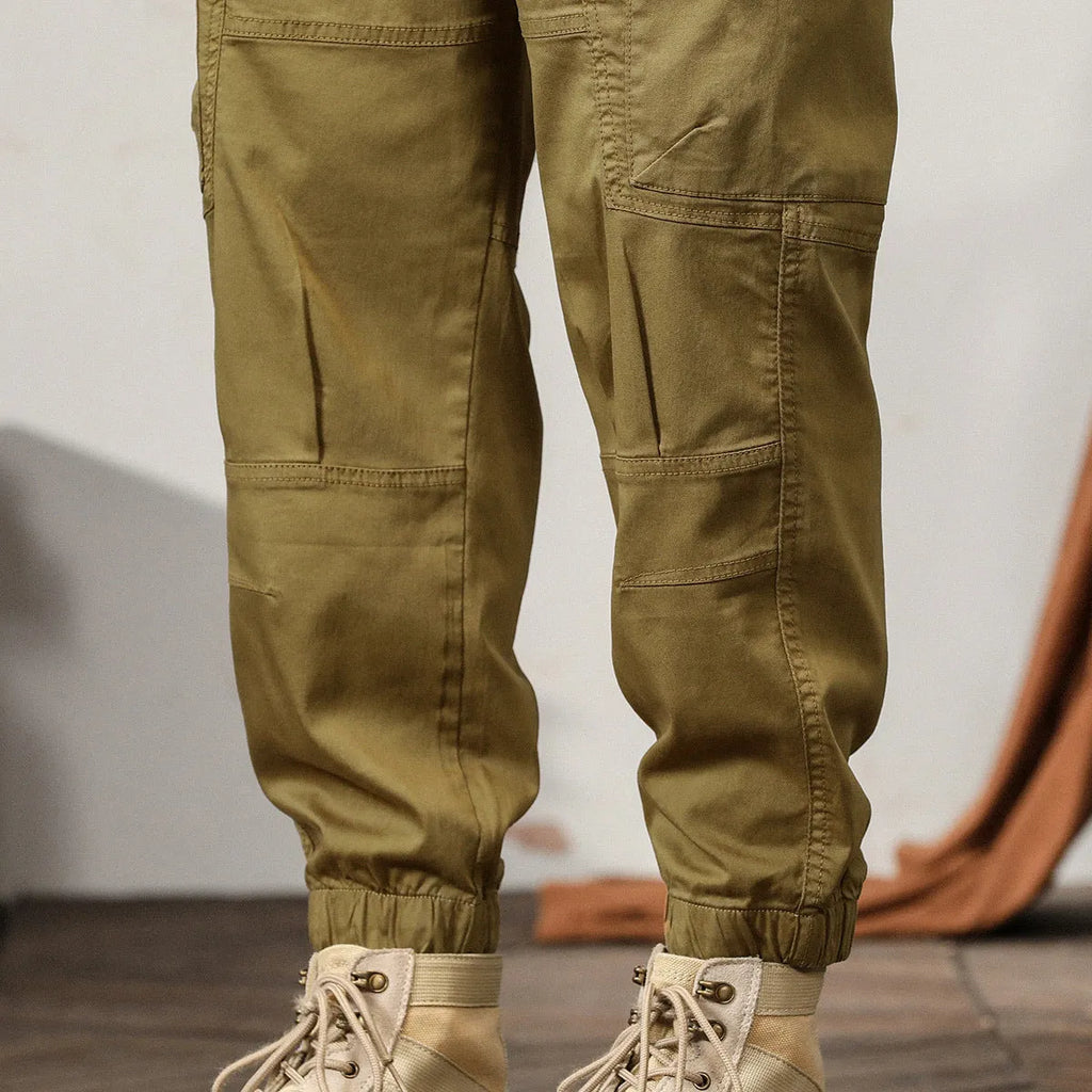 Men's khaki peacock green harem pants with tapered ankle bands and mid-waist design