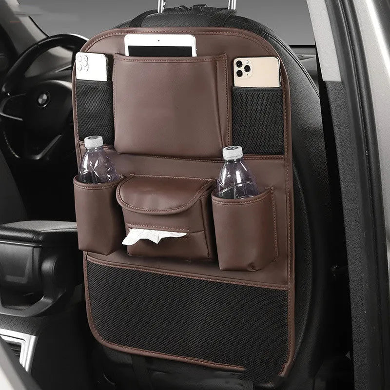 Leather car seat back storage bag in black, hanging behind a car headrest.