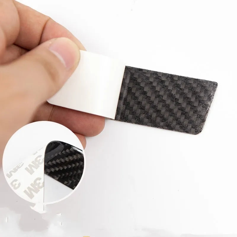 Set of four carbon fibre adhesive protection patches for Tesla Model S door handles.