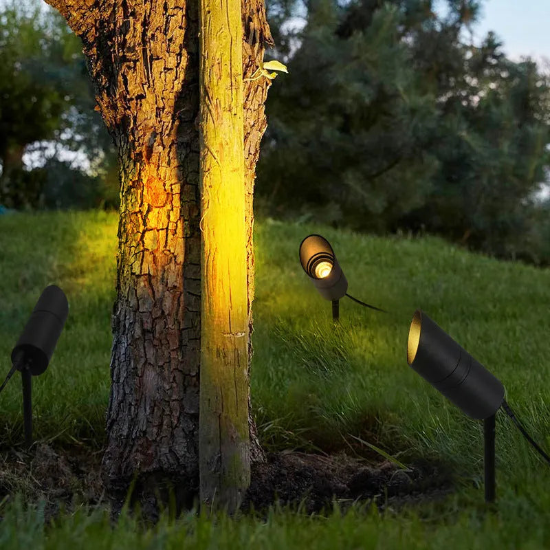 Outdoor aluminium ground lamp with COB LED for garden lighting on grass.