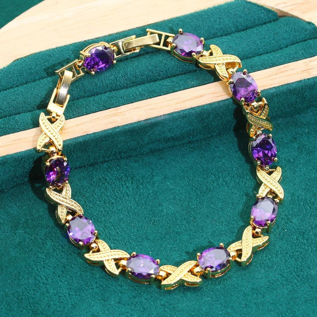 Complete 18k gold plated jewellery set with colourful zircon stones, showing necklace, earrings, ring, and bracelet.
