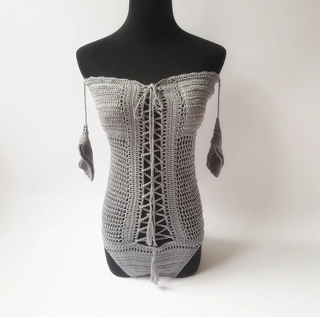 Off-shoulder one-piece swimsuit in white, black, grey, green, or pink.