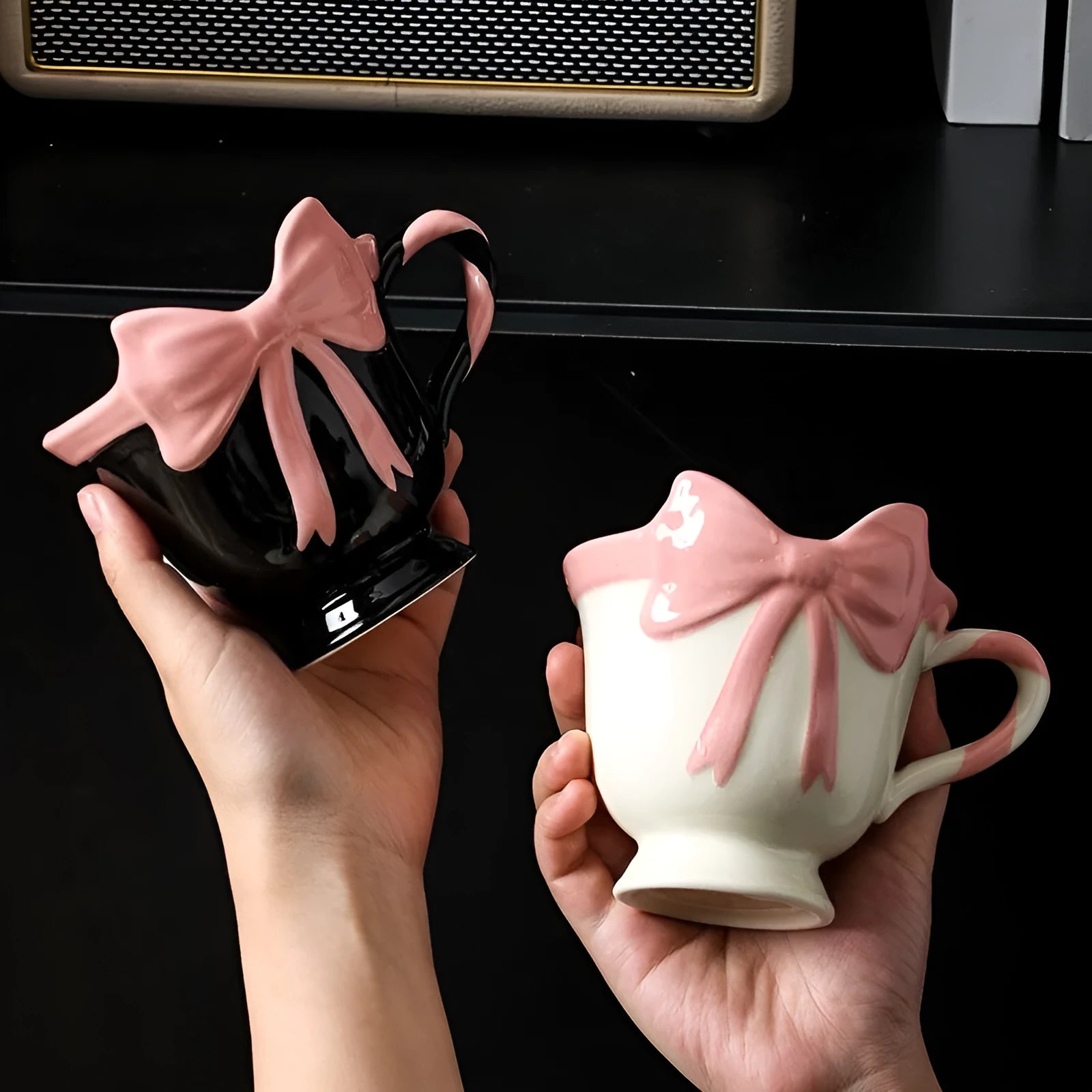 Ceramic mug with a decorative heart bow design in black pink or white powder colour.
