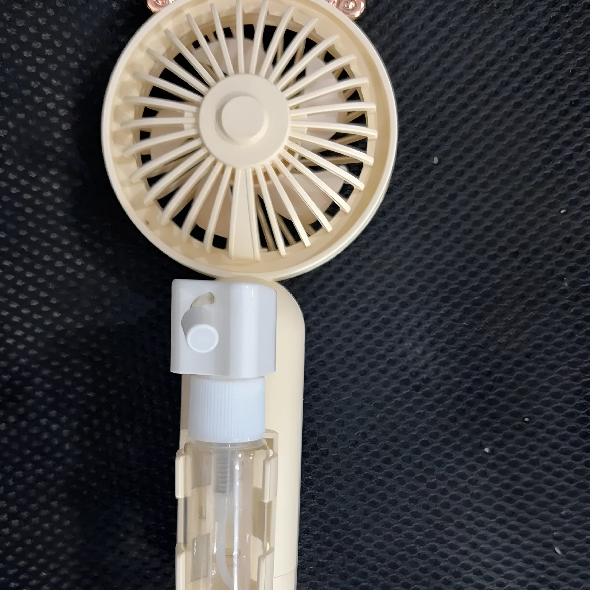 Portable plastic USB desk fan in a choice of apricot, blue, green, orange, or pink colours.
