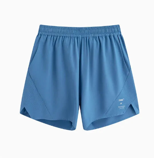 Close-up of black four-point stretch running shorts showing laser stitching detail on spandex fabric.