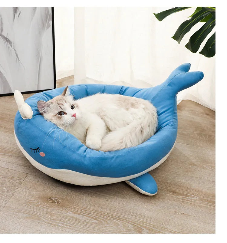 Blue duck-shaped fluffy pet bed sofa for small dogs and cats on a floor.