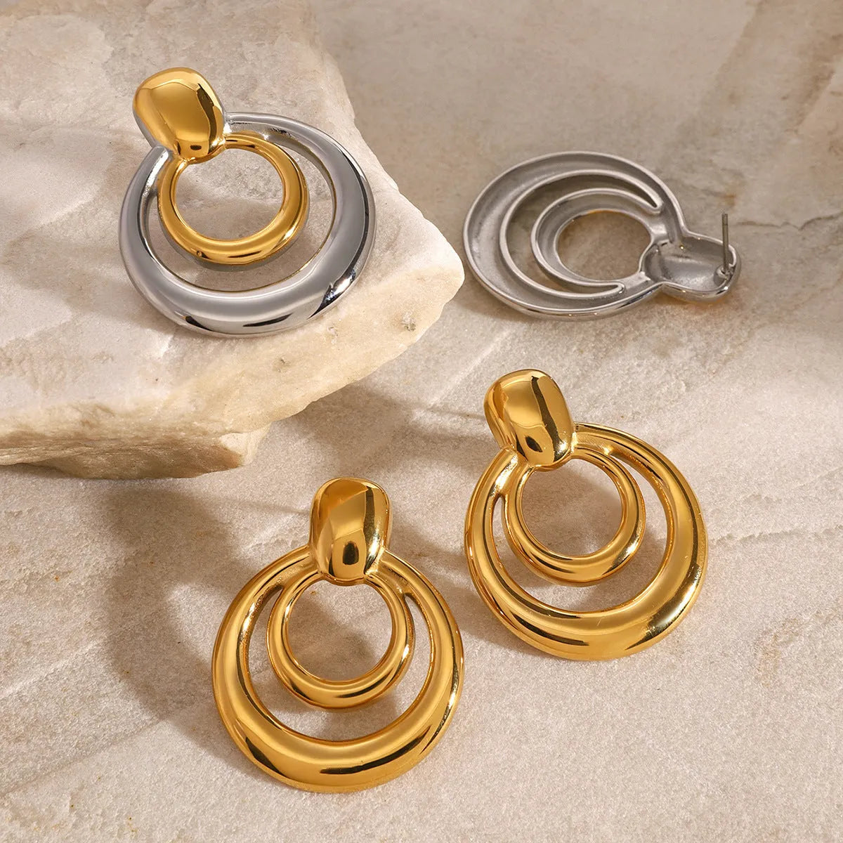 Round golden double-layer hollow stud earrings with geometric design and electroplated finish