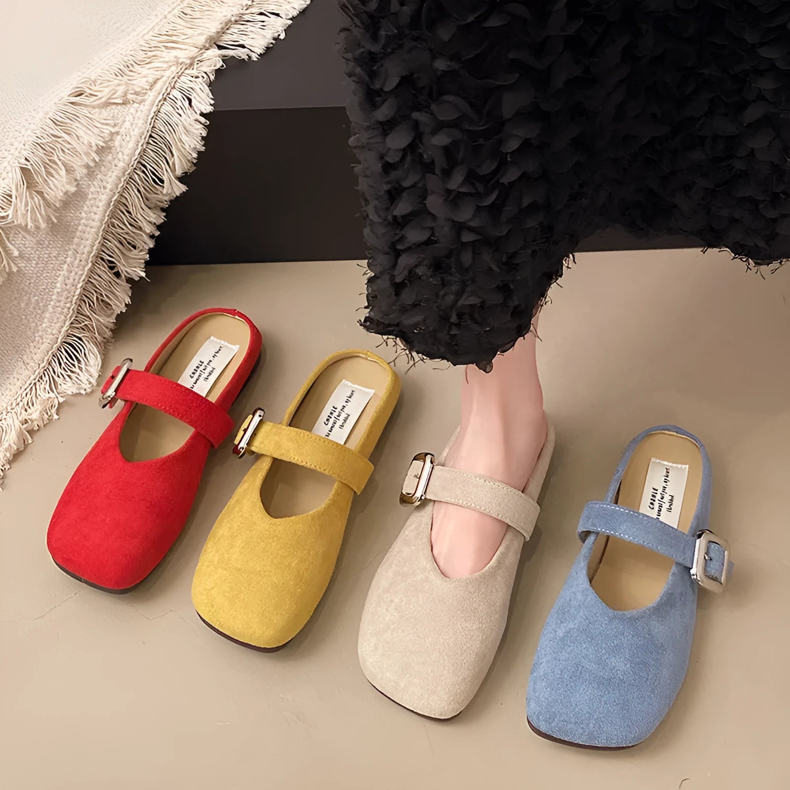 Women's flat closed toe slippers in apricot colour with square head and rubber sole.