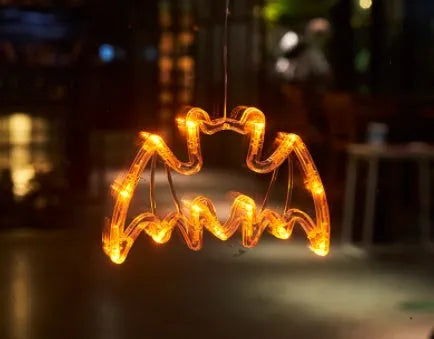 Seven Halloween themed battery-operated LED hanging lights with spider, pumpkin and ghost designs