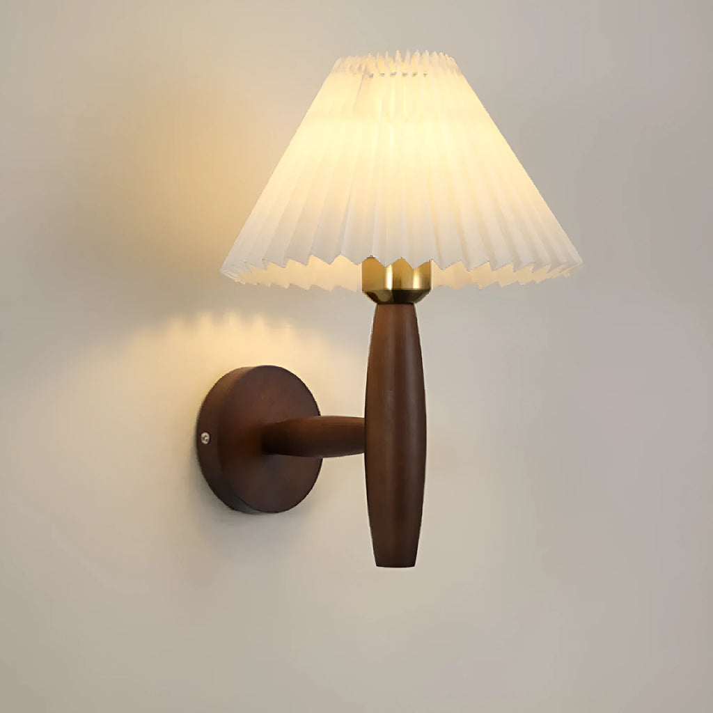 American retro style wall lamp with a walnut wood base and white fabric shade mounted on a wall.