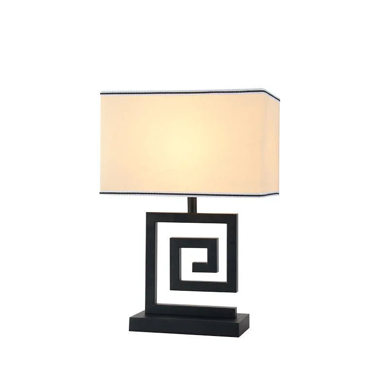 Retro modern Chinese table lamp with fabric lampshade and iron base on wooden side table