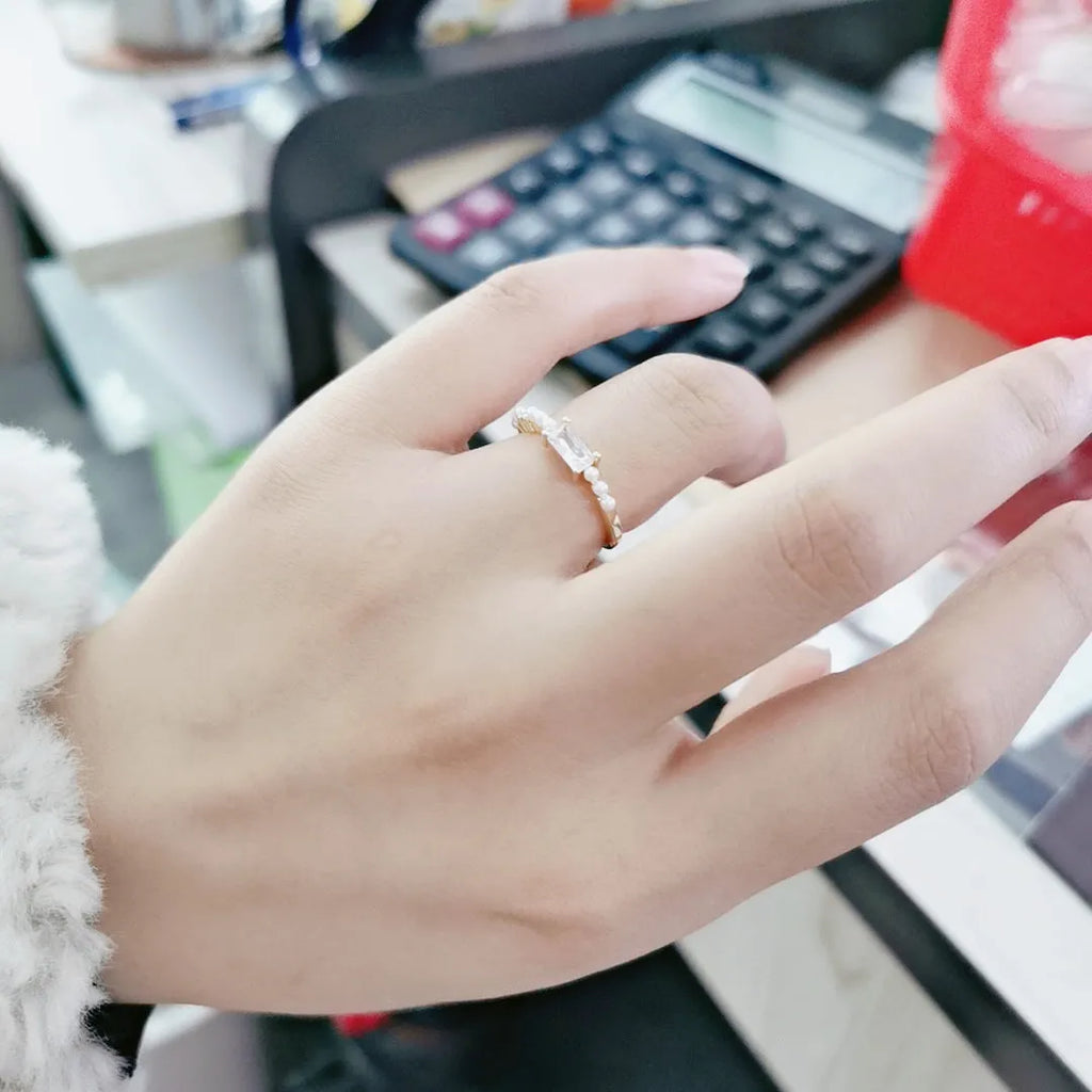 Women's gold-toned square alloy ring with diamond-cut surface and inlaid artificial gemstone on adjustable band