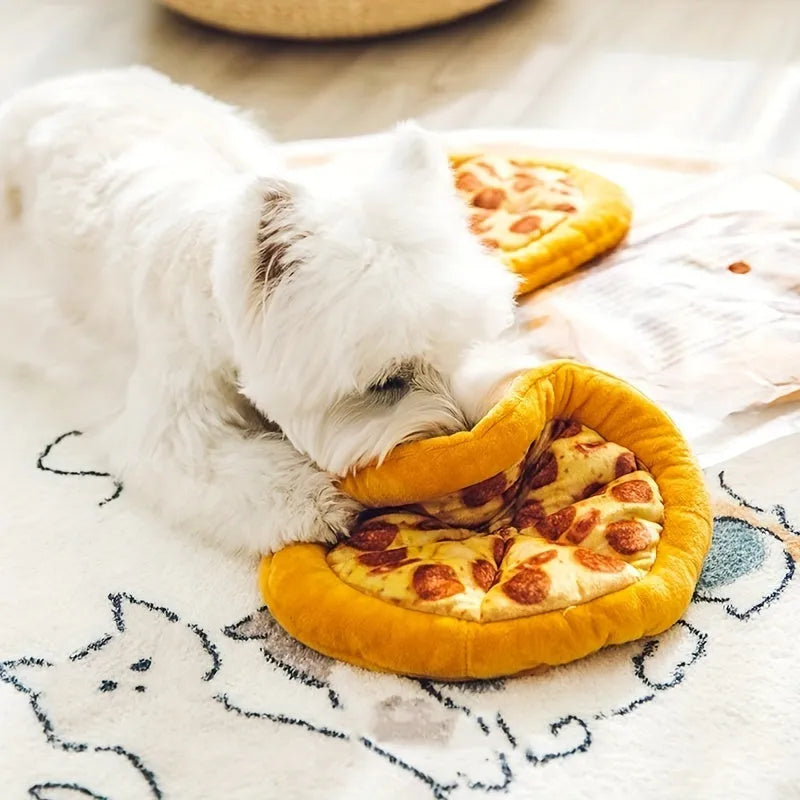 Yellow pizza slice shaped soft plush dog chew toy with squeaker on a white background.