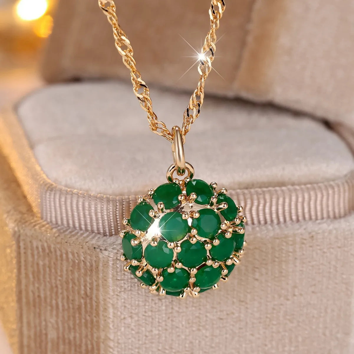 Champagne gold round emerald and diamond pendant necklace on a copper chain