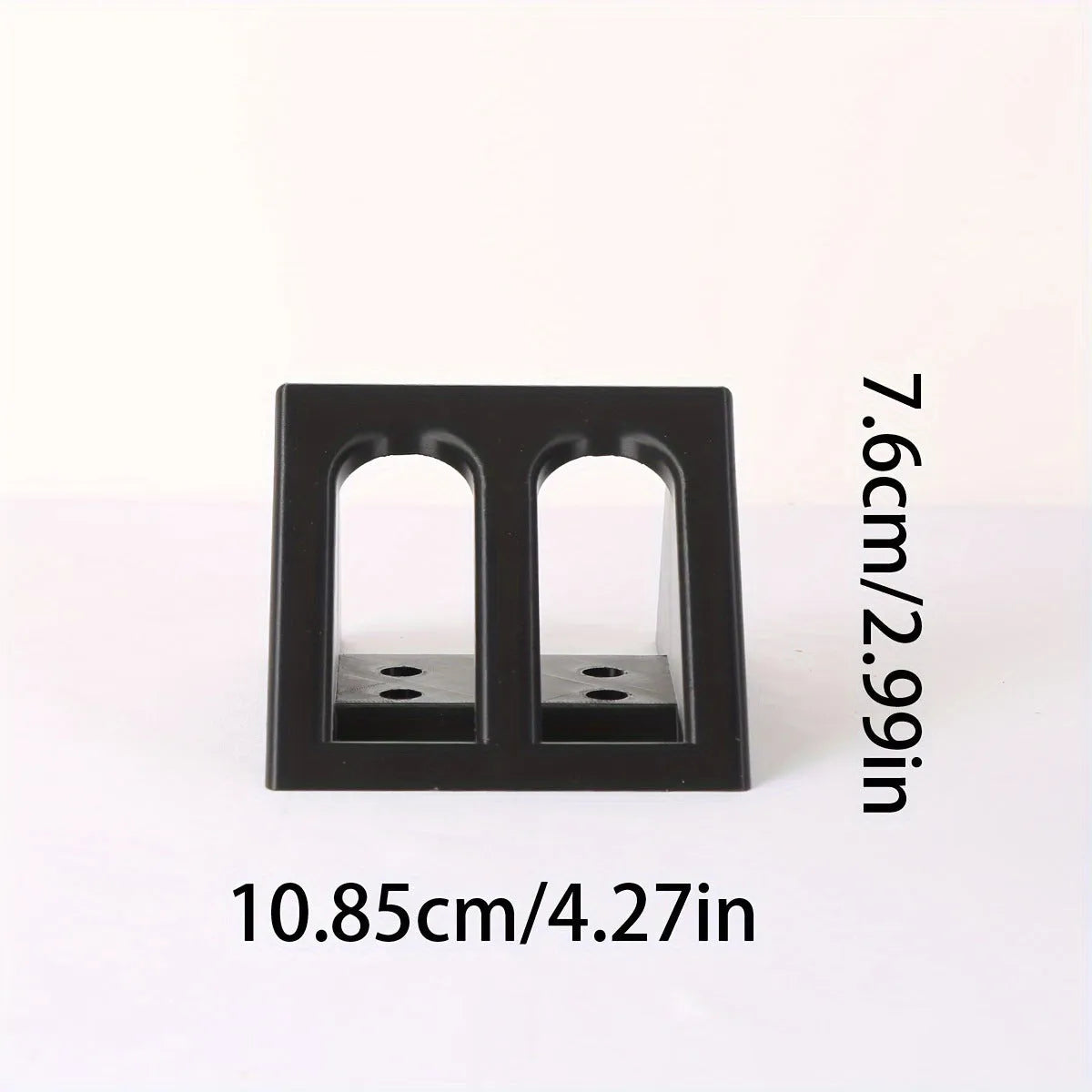 Black plastic pistol display stand with a punk-style design for gun replicas.