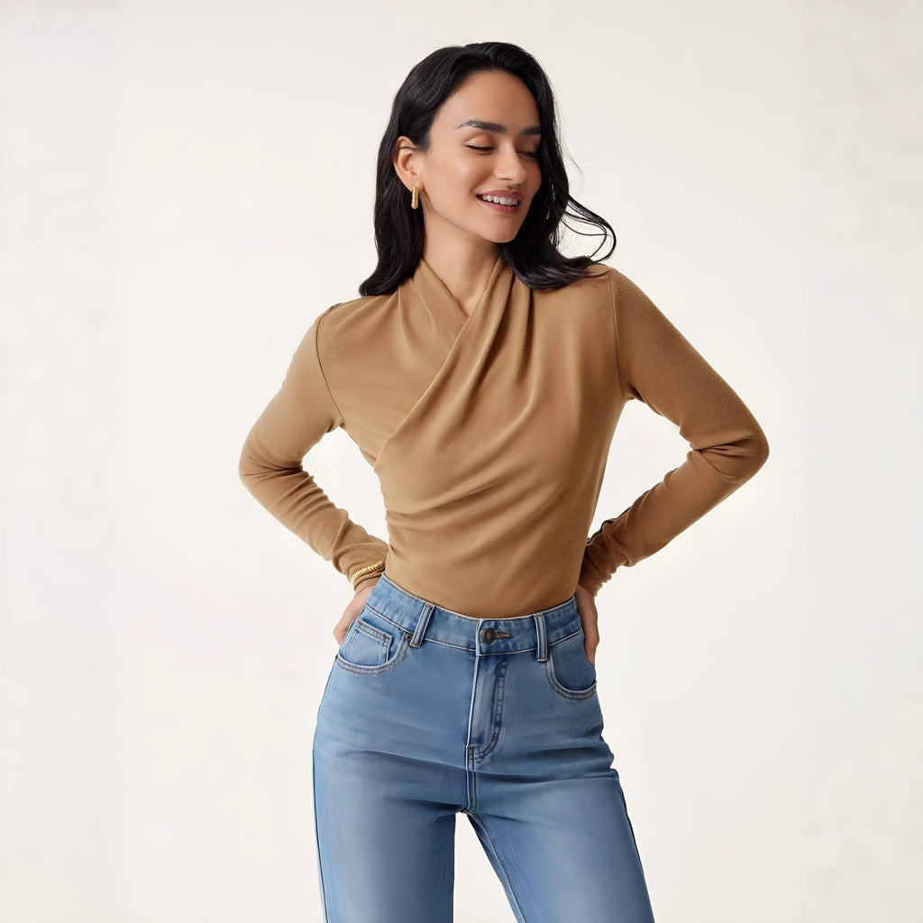 Camel-coloured women's slim fit pullover sweater with long sleeves on a hanger.