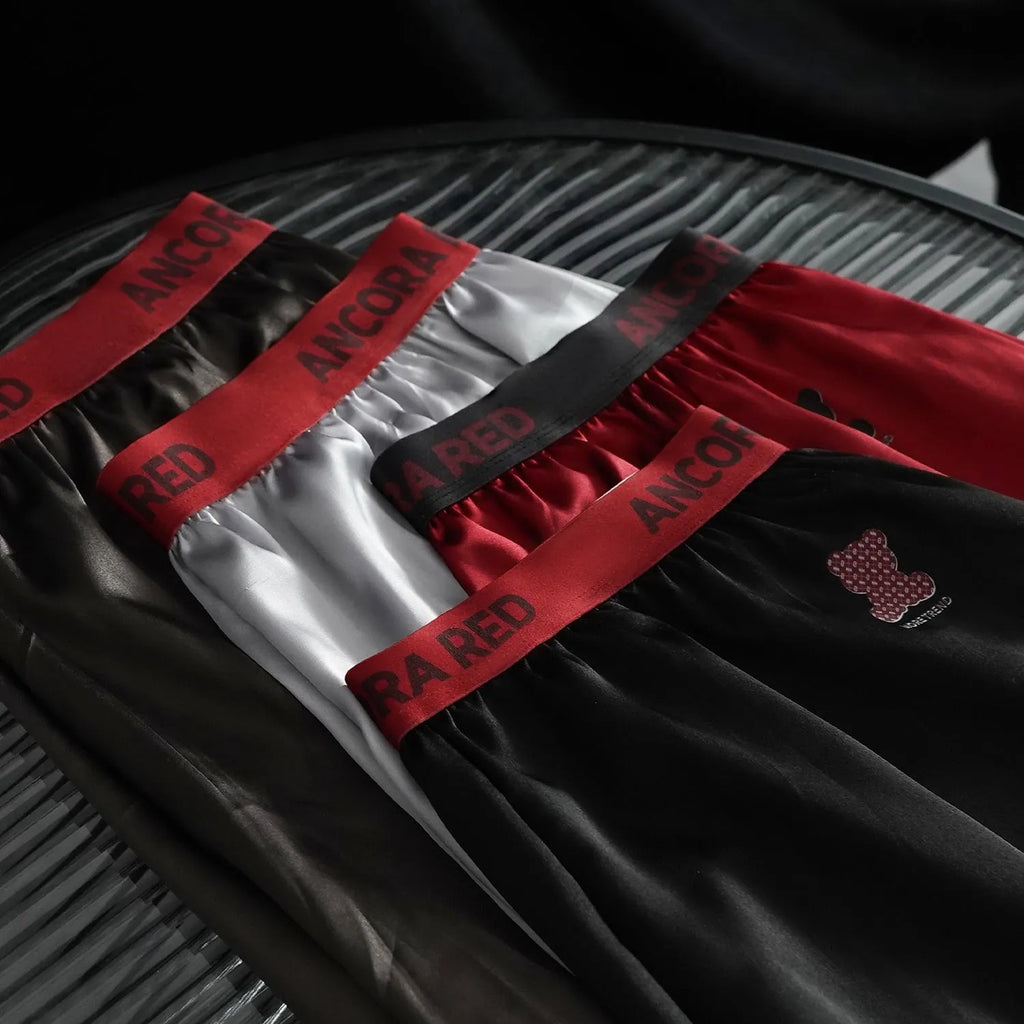 Men's solid colour boxer briefs in polyester knit fabric showing mid waist design and colour options