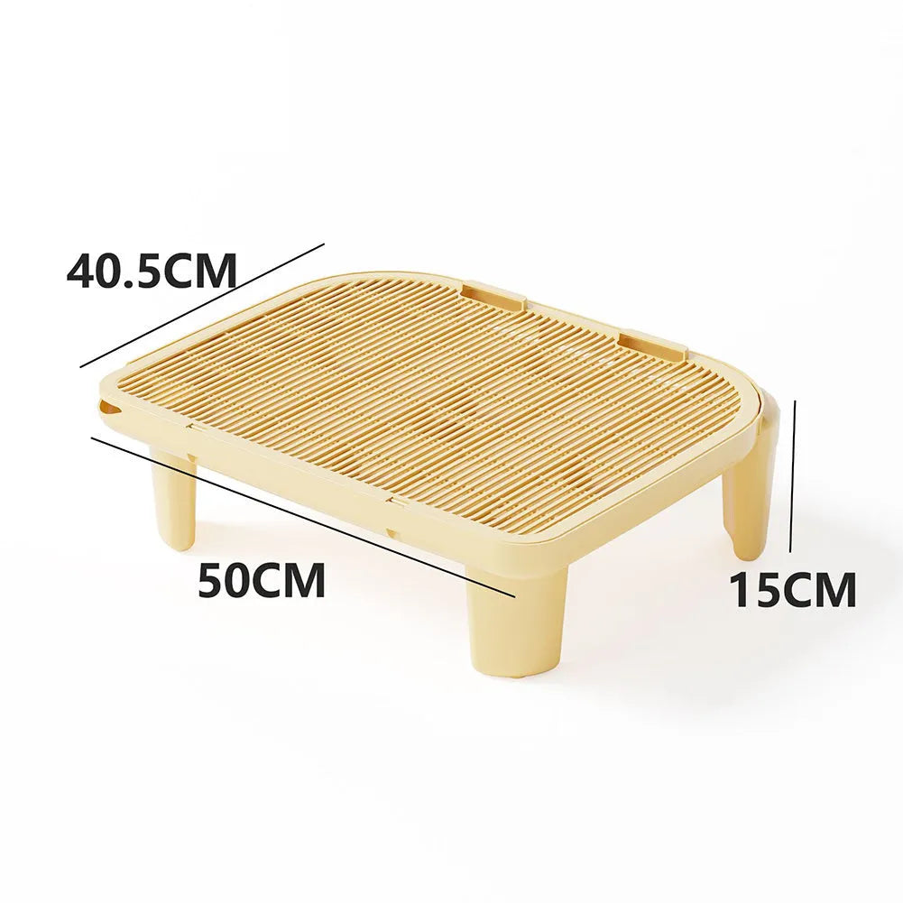 Oversized milk yellow plastic cat litter mat with anti-slip silicone feet on a hardwood floor