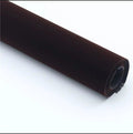 Roll of self-adhesive leather suede fabric in BMW brown colour next to a car dashboard.
