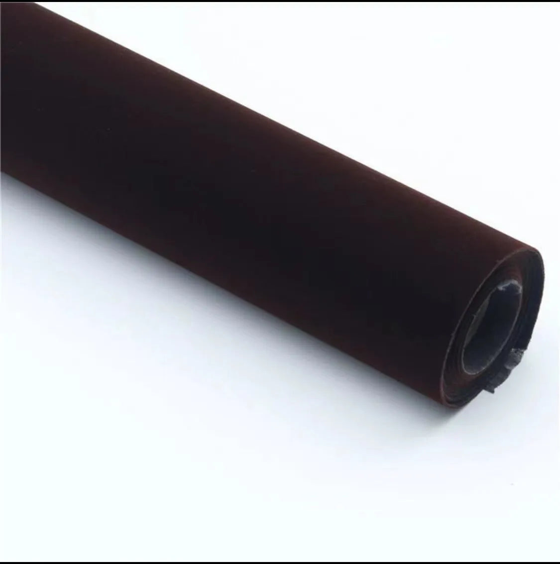 Roll of self-adhesive leather suede fabric in BMW brown colour next to a car dashboard.