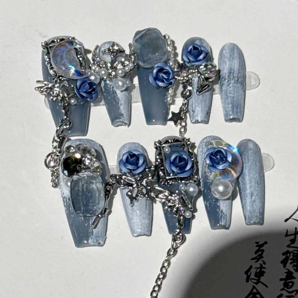 Evening manicure set in heavy industry night blue with rose, tulip, and flower patterns on plastic armour suit