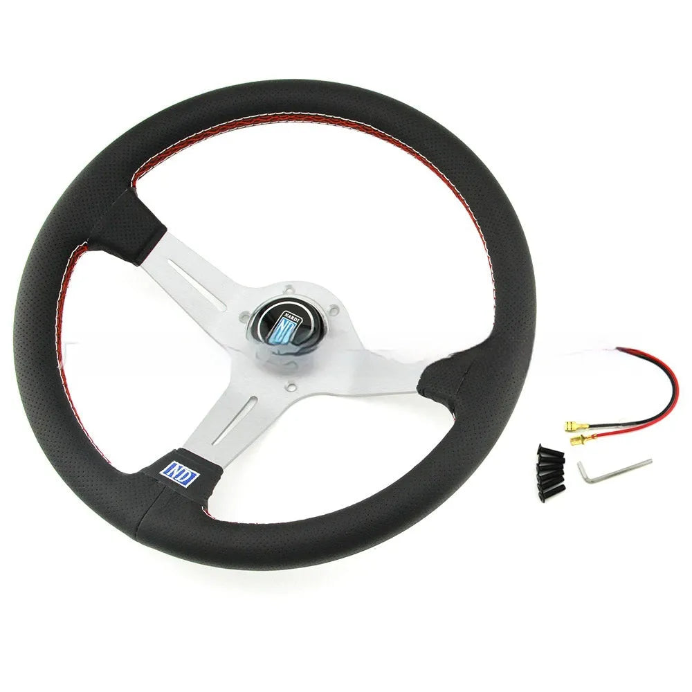14-inch silver black leather steering wheel with concave centre grip and skeleton frame visible