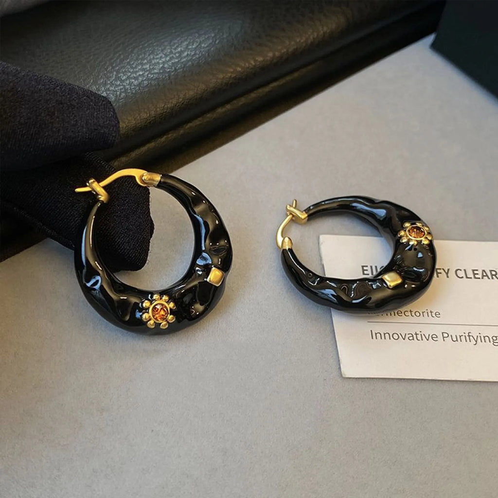 Retro alloy ear studs with dripping oil texture and rhinestone decorations in black or red colours