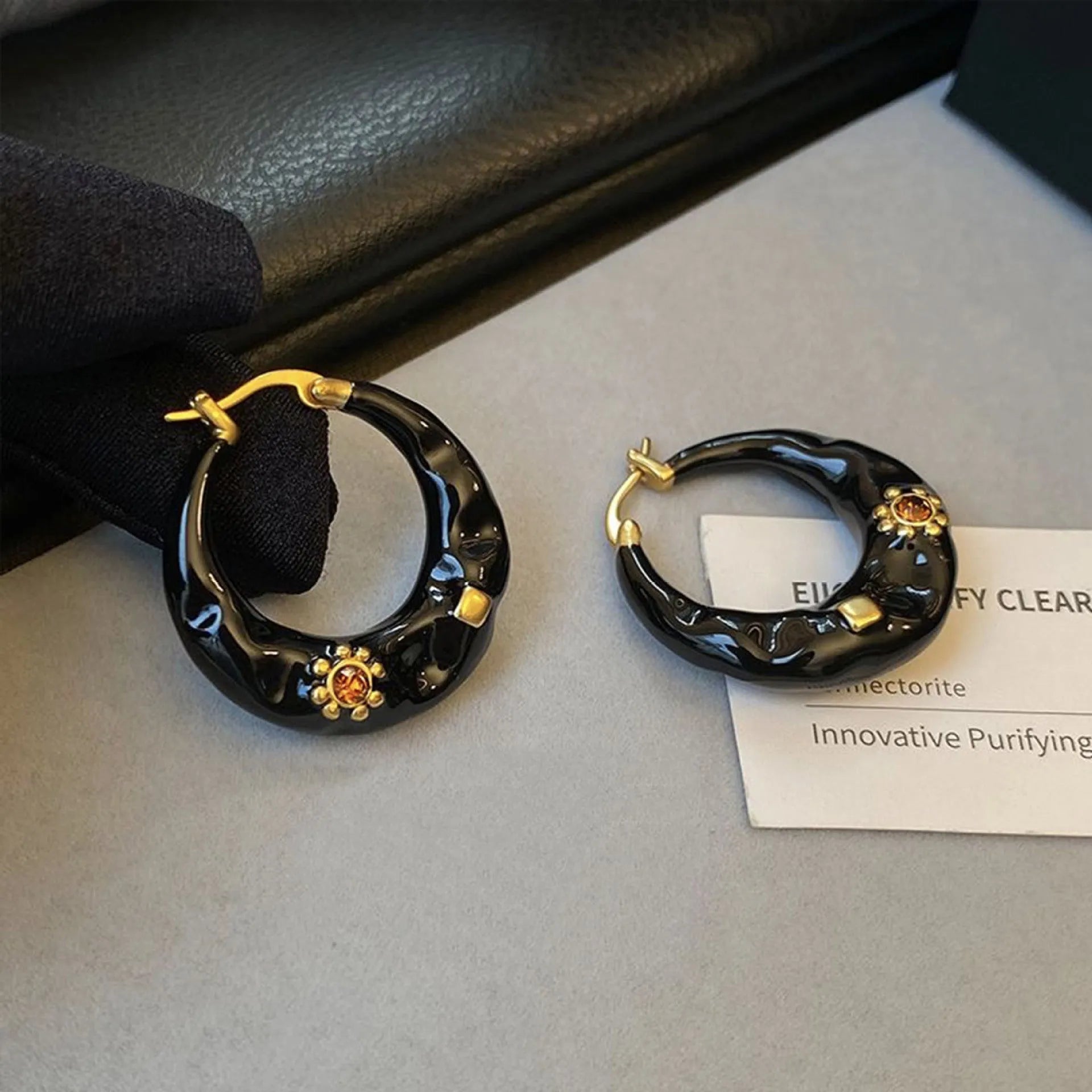 Retro alloy ear studs with dripping oil texture and rhinestone decorations in black or red colours