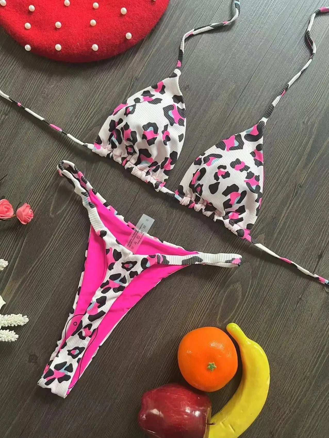 Women's briefs-style bikini swimsuit in a printed pattern, made from nylon with a cotton lining.