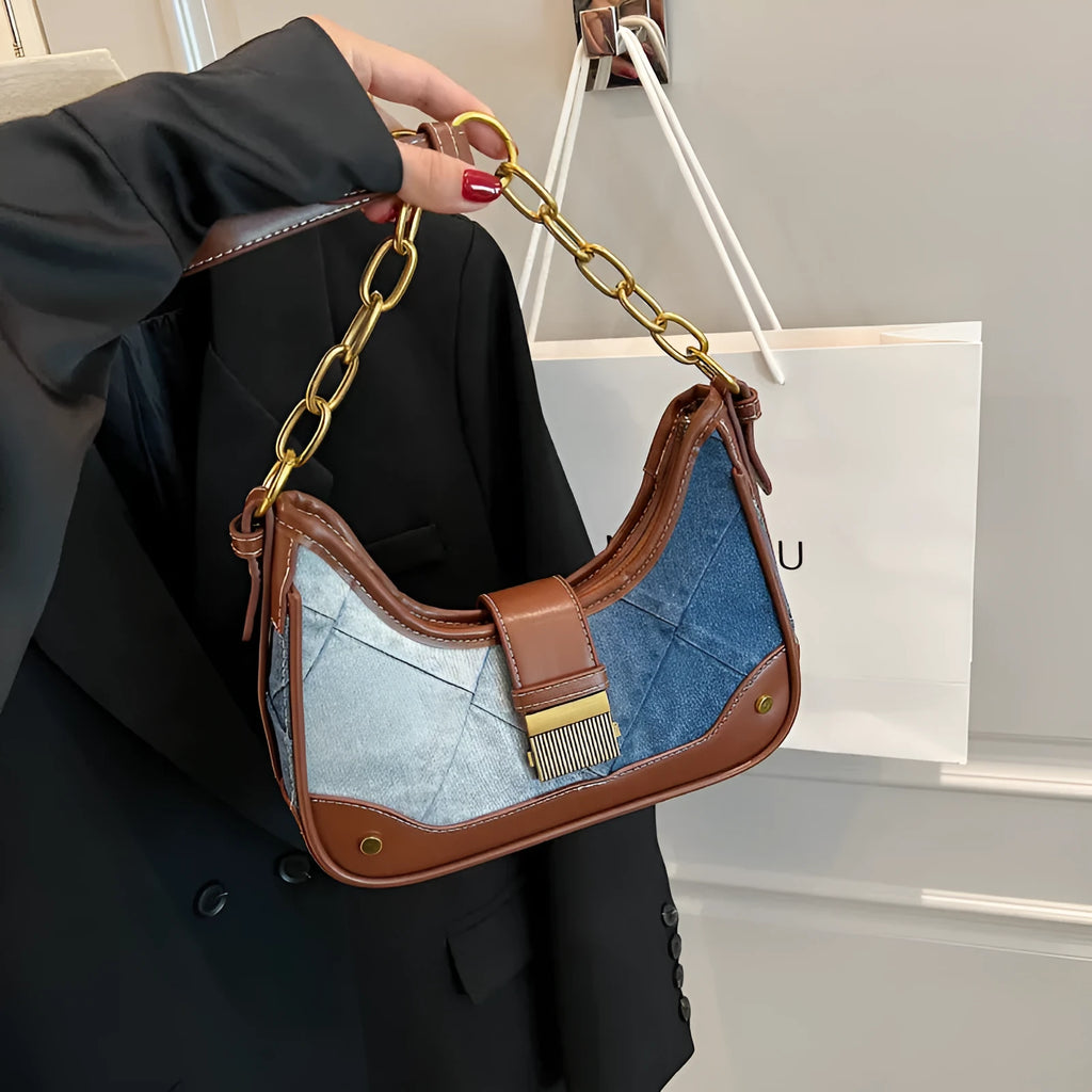 Brown denim women's shoulder bag with chain straps and bucket design showing phone compartment