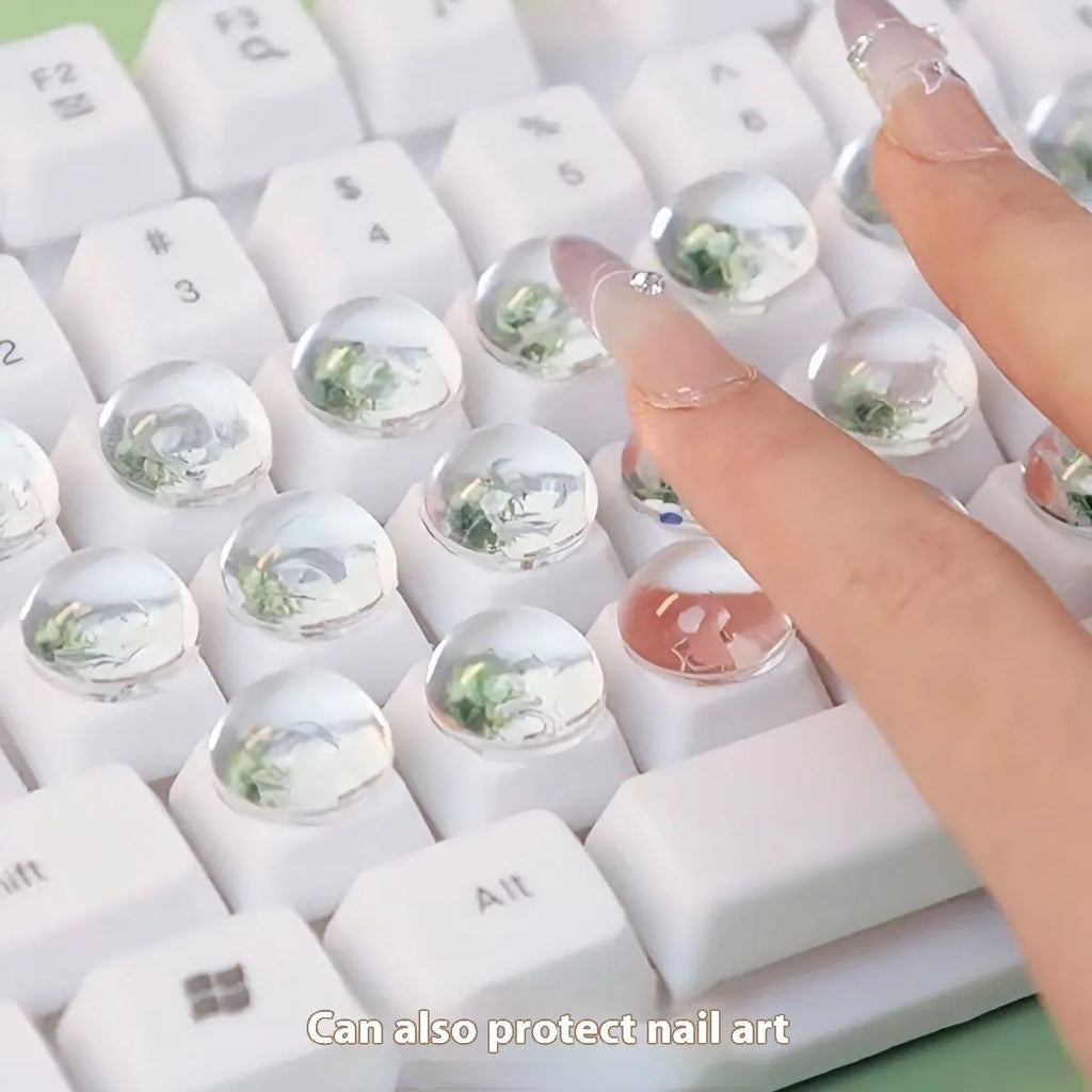 Crystal glass ball keyboard stickers in 12x6mm size on a white keyboard showing raised design