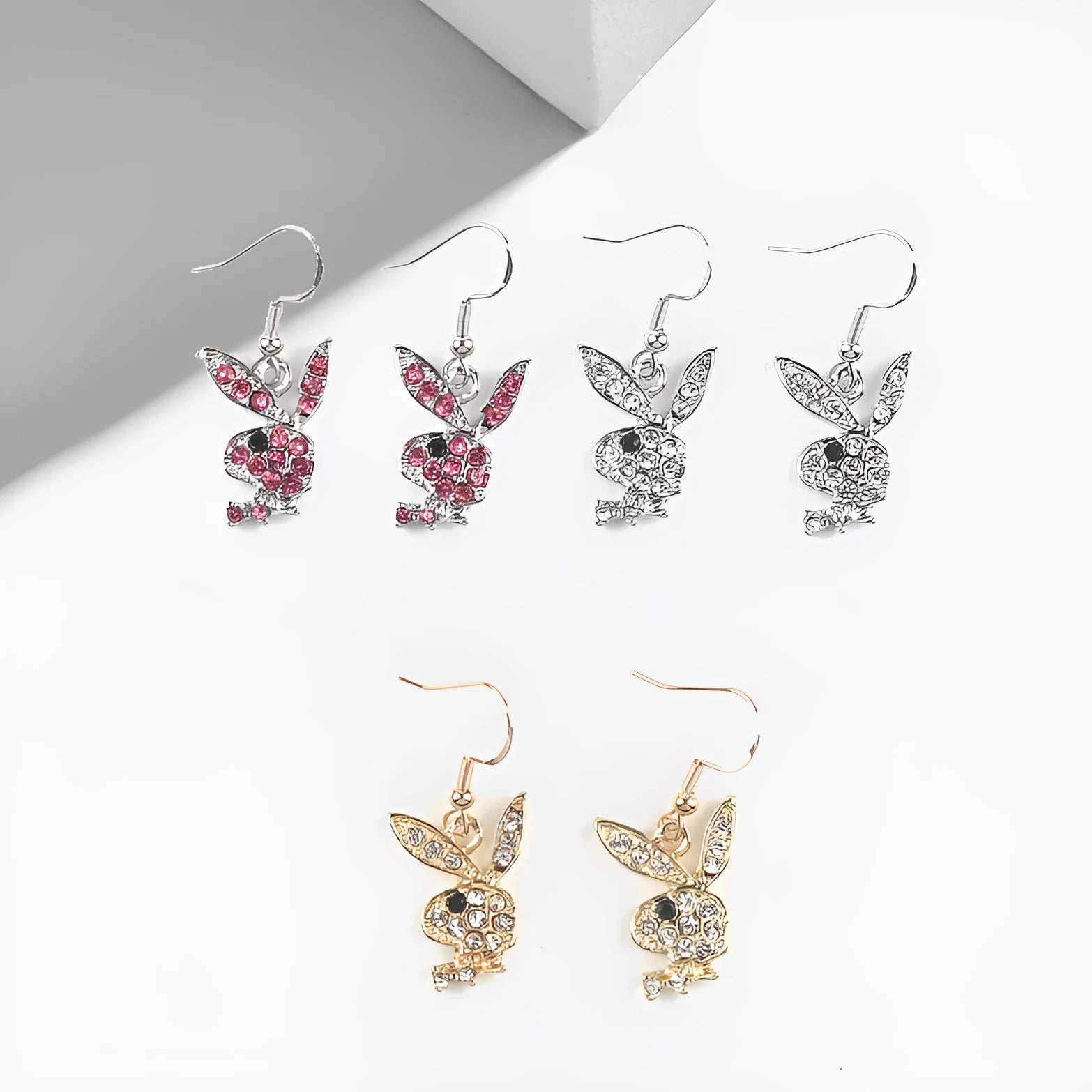 A pair of cute full diamond rabbit stud earrings in a choice of silver, pink, or gold.