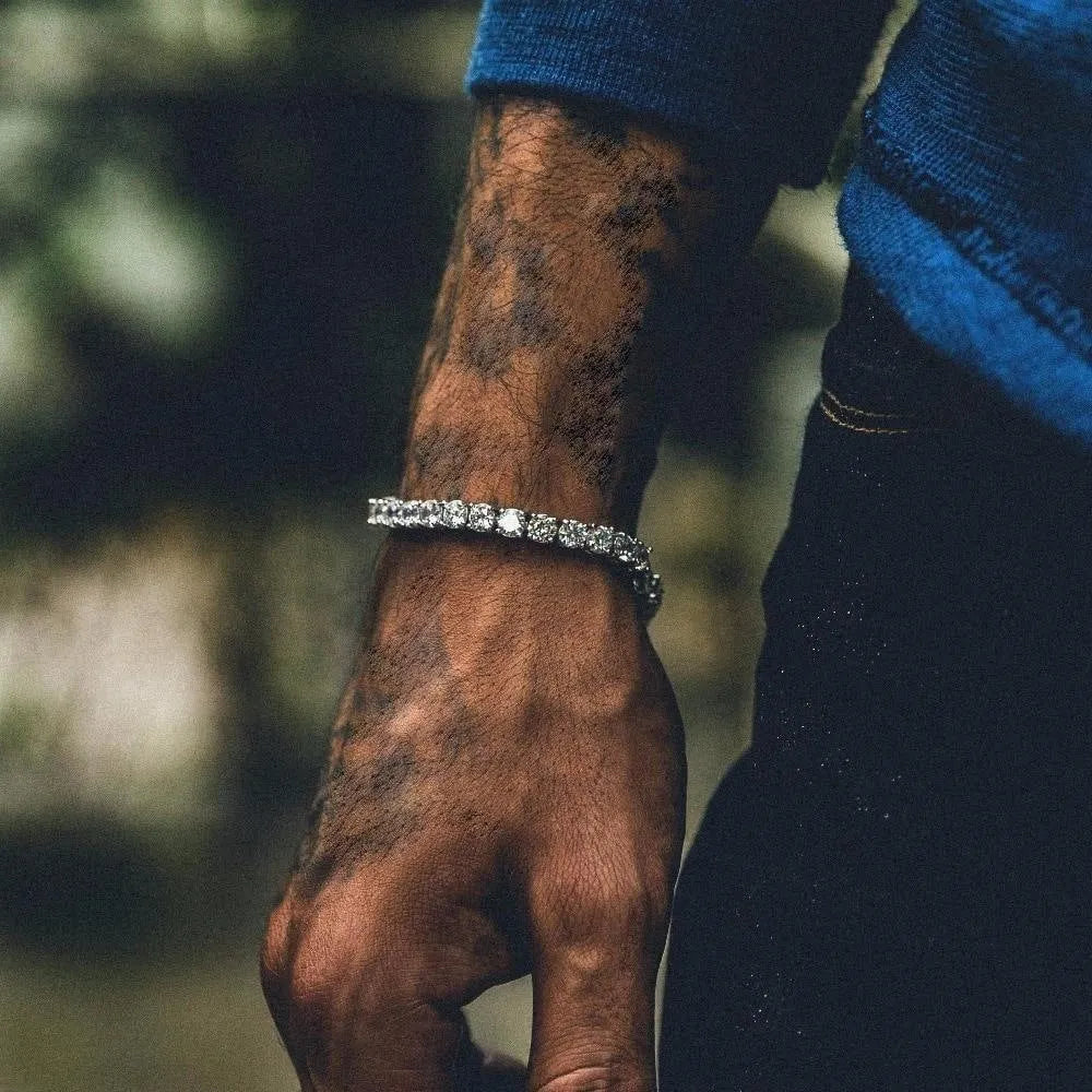 Men's silver alloy hip hop bracelet with a single row of clear rhinestones and geometric zirconia charms on a link chain.