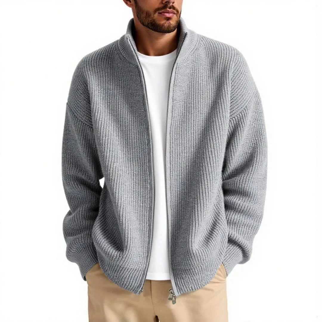 Man wearing a loose-fit grey cardigan sweater, a casual base layer for leisure wear.